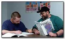 Tutor works with adult student on reading skills