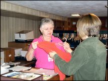 RSVP volunteer working in thrift store.